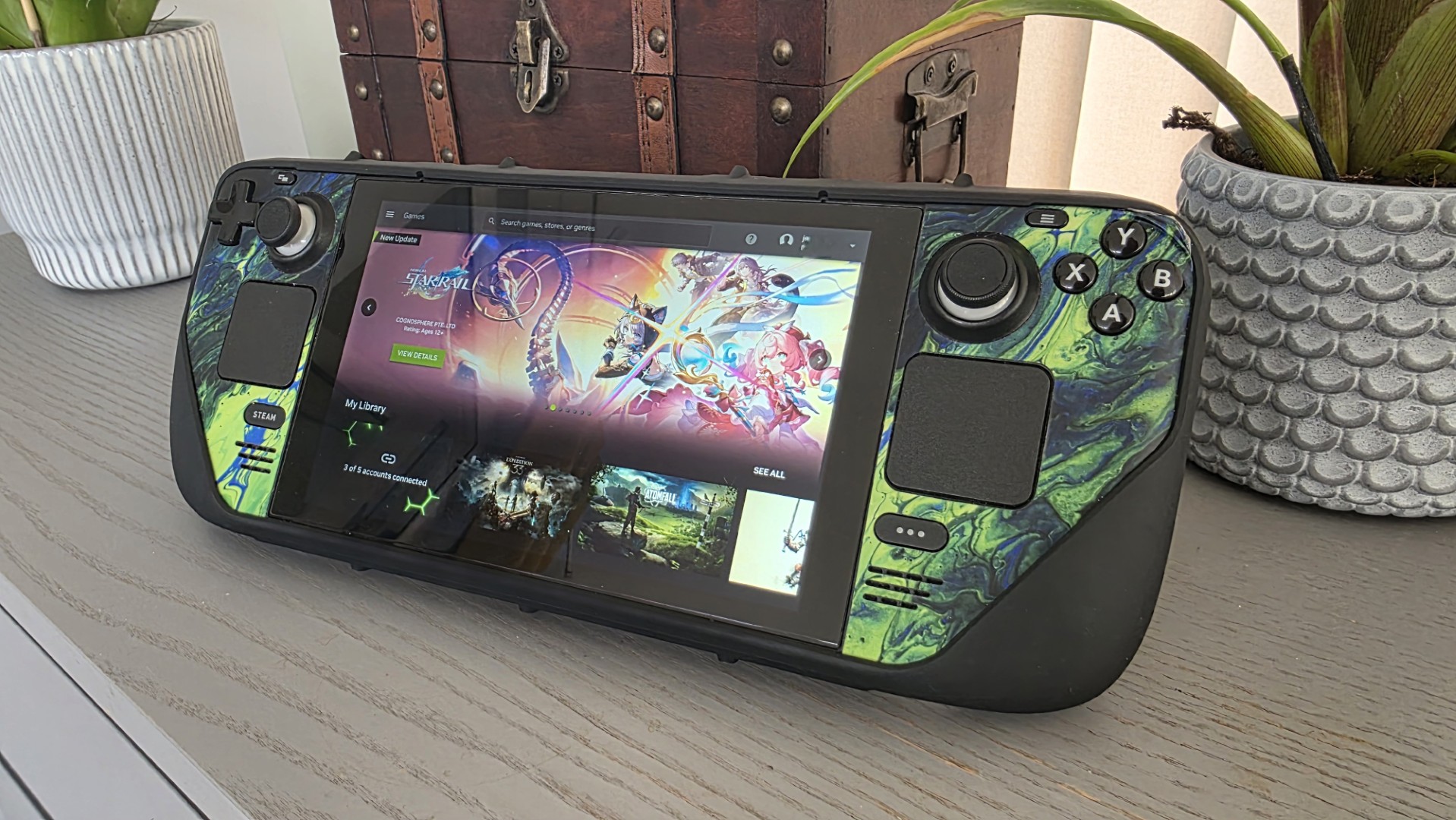 A Steam Deck with a green case