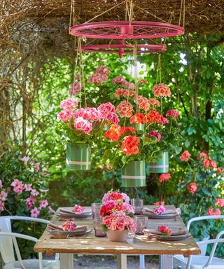 summertime dining scene under cover with hanging planter