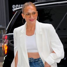 Jennifer Lopez wears a white blazer
