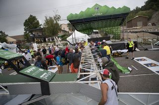 The finish line truss at the Tour of Utah's stage 5 lays across the road after high winds blew it down during the awards ceremony.