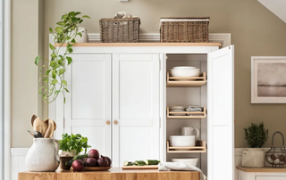 white kitchen furniture with storage baskets