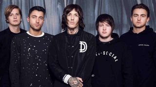 Bring Me The Horizon posing for a photograph in 2015