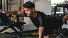 a man performing the bird dog core exercise