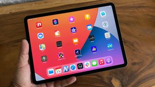 An Apple iPad Pro 11 (2021) from the front, in someone's hand