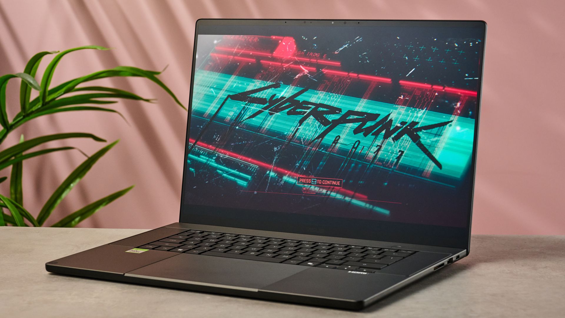 The Asus ProArt P16 RTX Spark showing the Cyberpunk 2077 splash screen on its display.