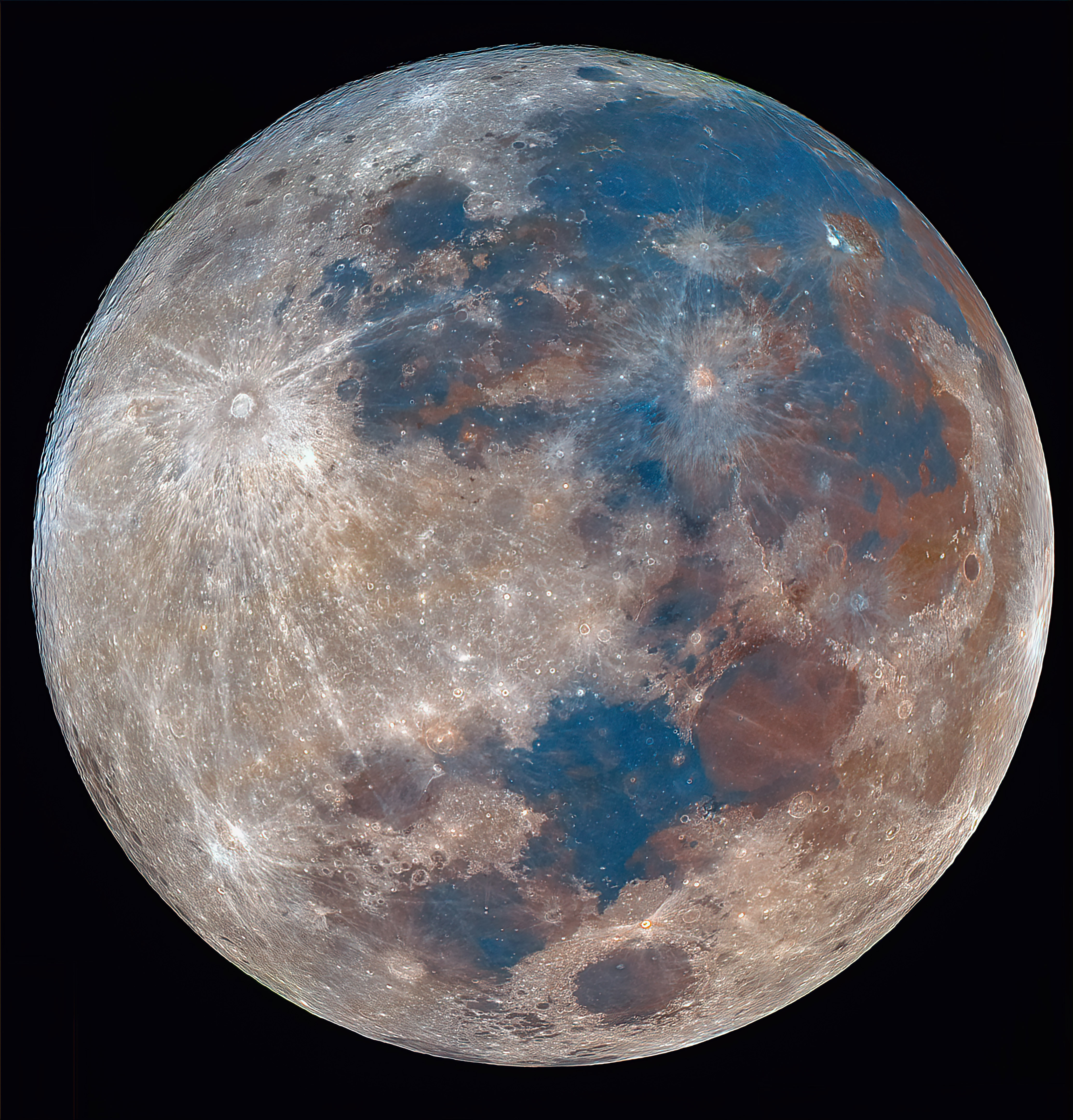 A closeup of our moon with blue spots and bright light reflecting across it