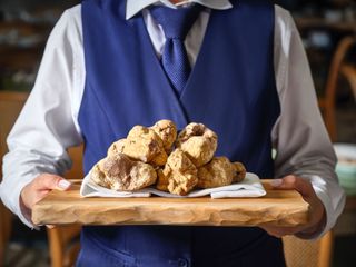 Man carries board of truffles