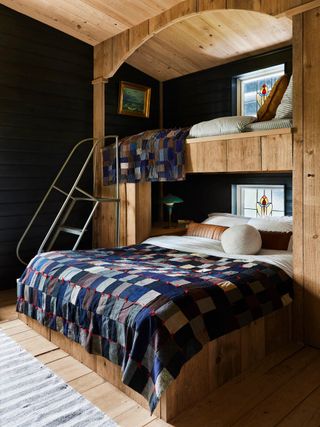 A bed with colorful quilt