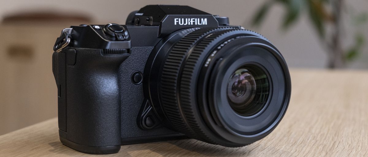 The Fujifilm GFX50S II on a wooden table