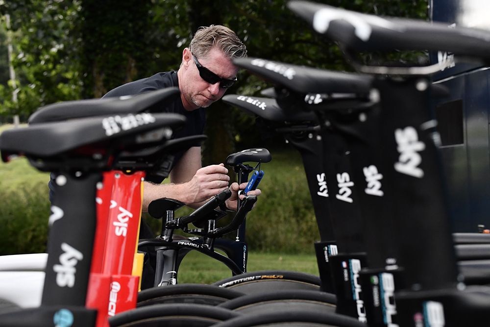Team Sky mechanic getting the time trial bikes ready for the riders ahead of a training ride