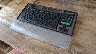 A keyboard on a wooden bench