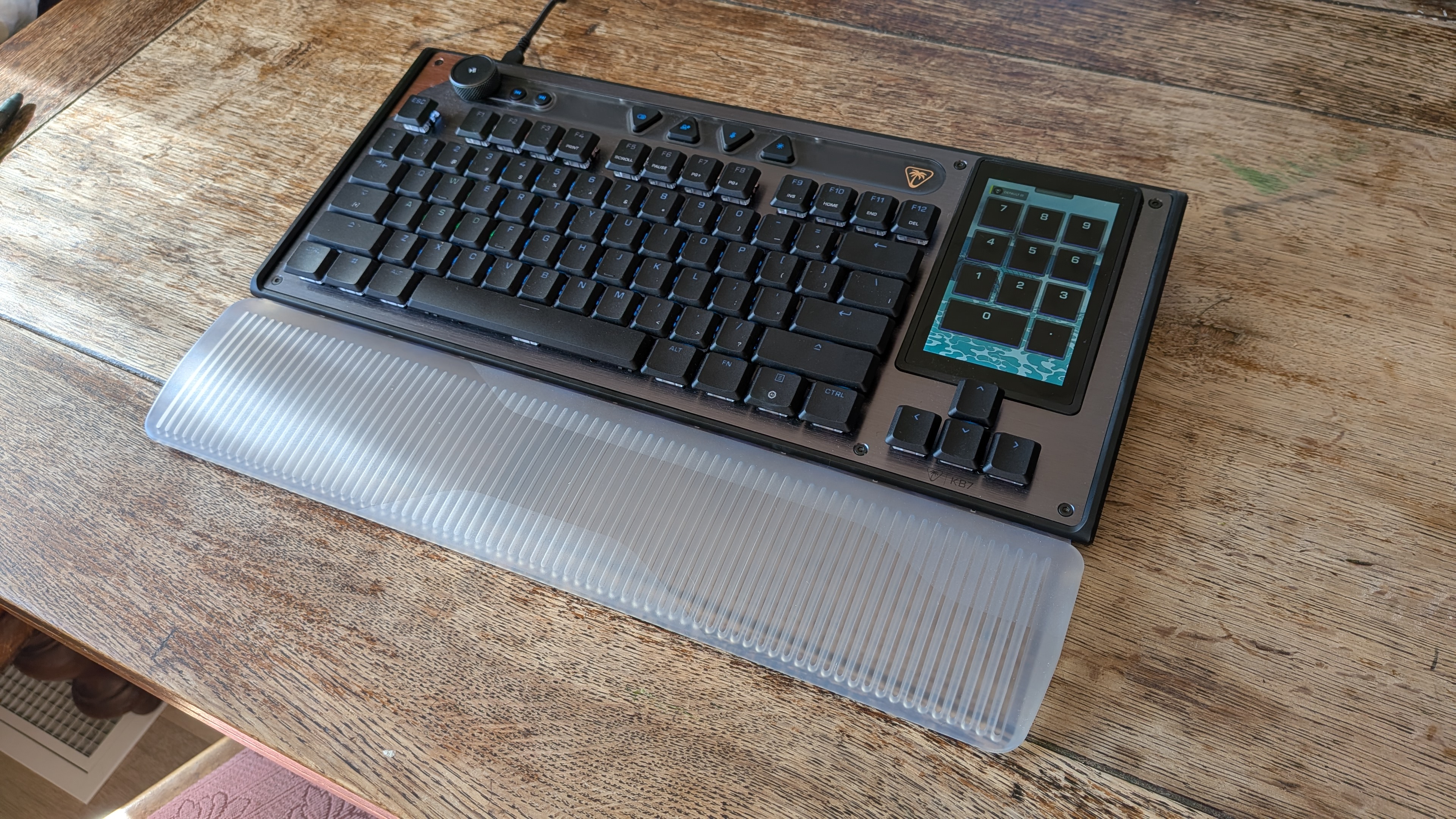 A keyboard on a wooden bench
