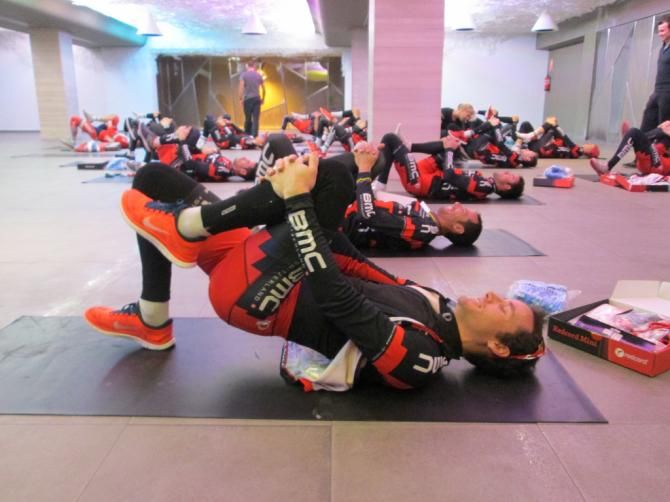 Riders do some yoga to limber up