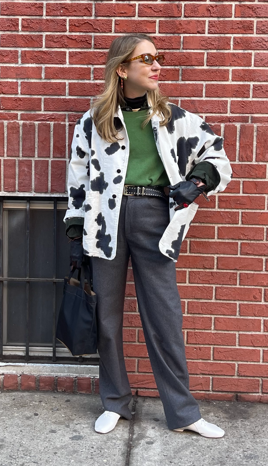 Elizabeth Cardinal Tamkin pairs a green top with a loud cow print