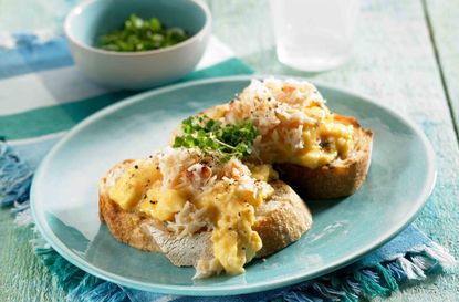 Scrambled egg and crab on garlic croutes