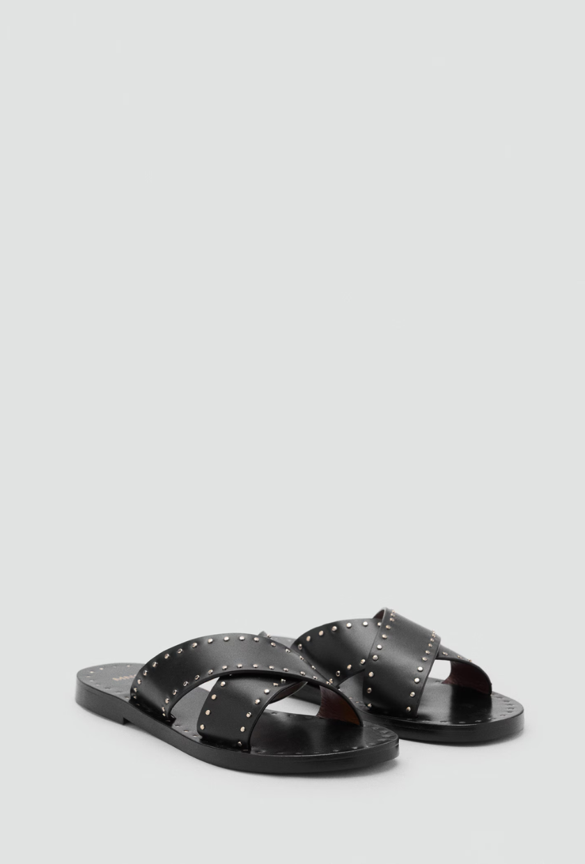 An image of studded flip-flops from Mango.