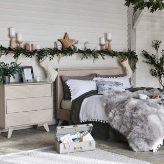 Christmas bedroom with real greenery