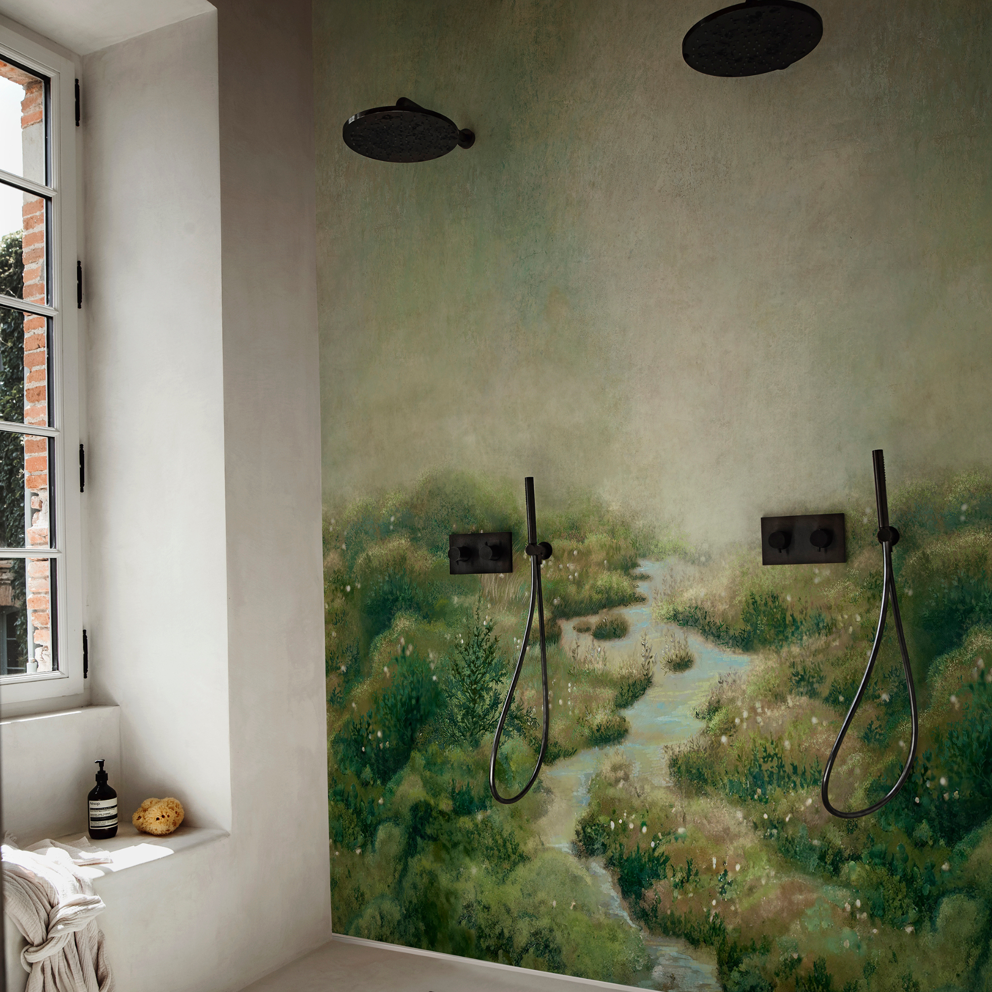 a double shower space with wallpaper wall and black hardware