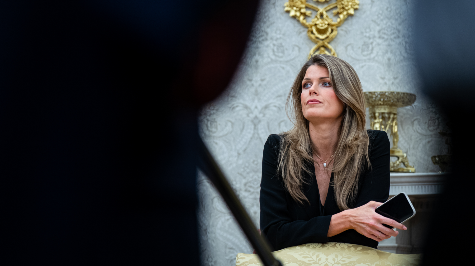 Lindsey Halligan, attorney for US President Donald Trump, during an executive order signing in the Oval Office of the White House in Washington, DC, US, on Monday, March 31, 2025. The order directs the Federal Trade Commission to work with the Department of Justice to ensure that competition laws are enforced in the concert and entertainment industry, and pushes state consumer protection authorities on enforcement. Photographer: Al Drago/Bloomberg via Getty Images