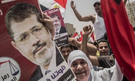 Egyptian supporters celebrate a premature victory for their presidential candidate, the Muslim Brotherhood&amp;#039;s Mohamed Morsi, in Tahrir Square on June 18, despite official results not having be