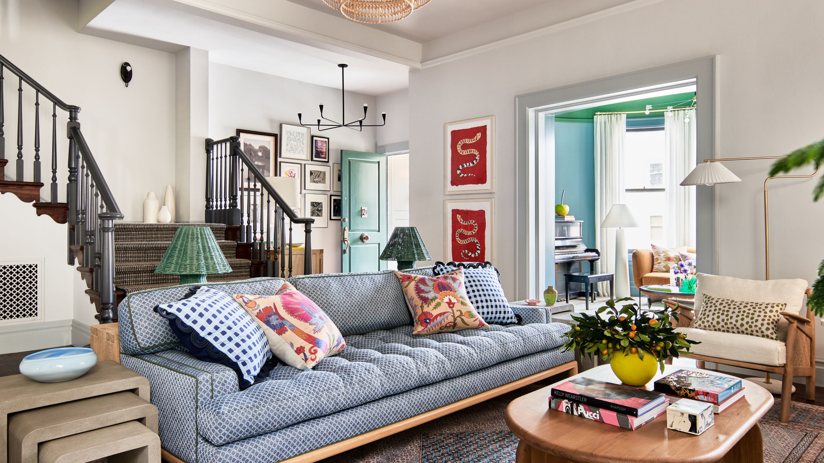 neutral living room entryway open plan area of a colorful San Francisco home with a light blue couch