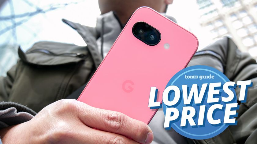 Pixel 9a held in the hand with lowest price badge.