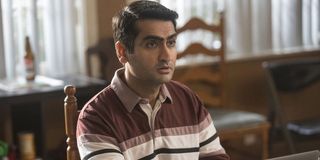 Dinesh (Kumail Nanjiani) sits in a wooden chair in a scene from 'Silicon Valley'