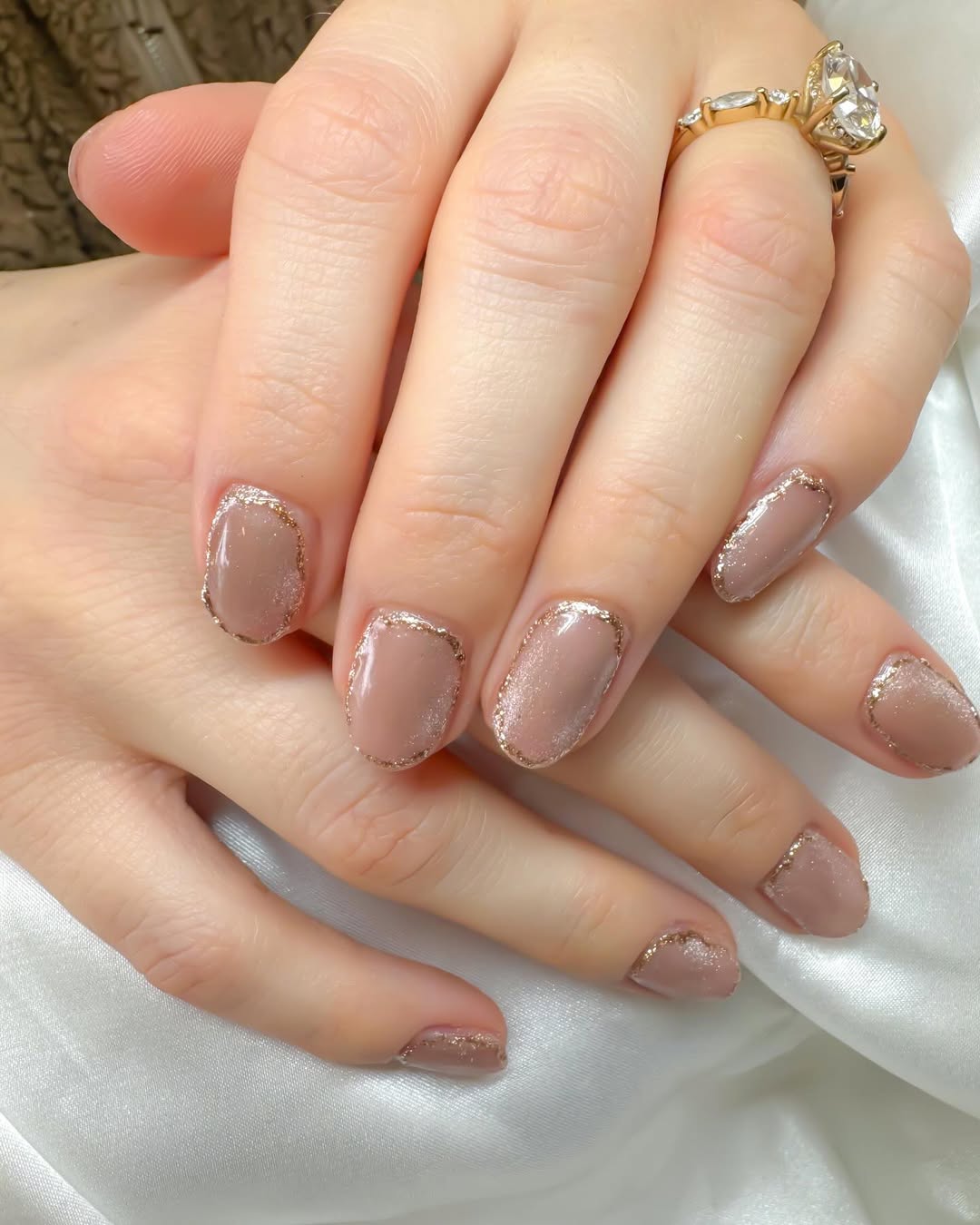 nude cat eye with gold detail oval nails