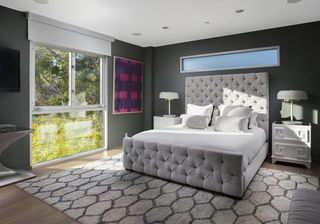 bedroom with grey wall glass door