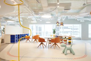 Office space in Dubai with playful elements and a dog chair in green
