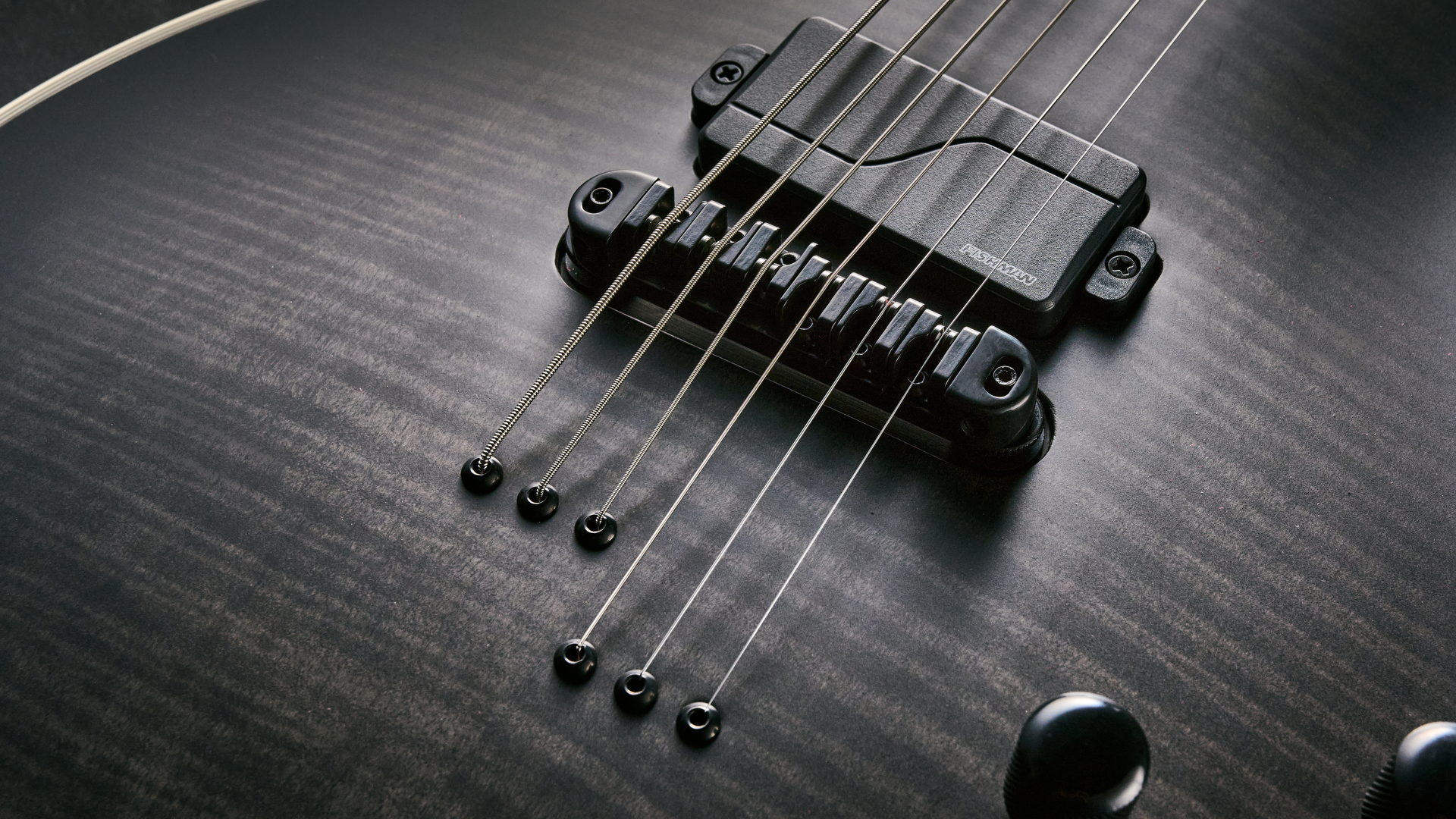 The asymmetric string through ferrules on the Epiphone Prophecy Les Paul Baritone