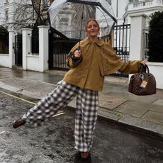 posing for a photo wearing trousers