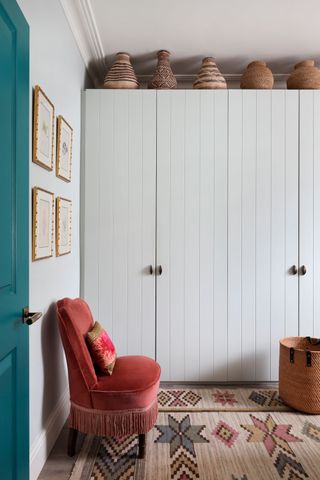 a built-in wardrobe with tongue and groove MDF doors