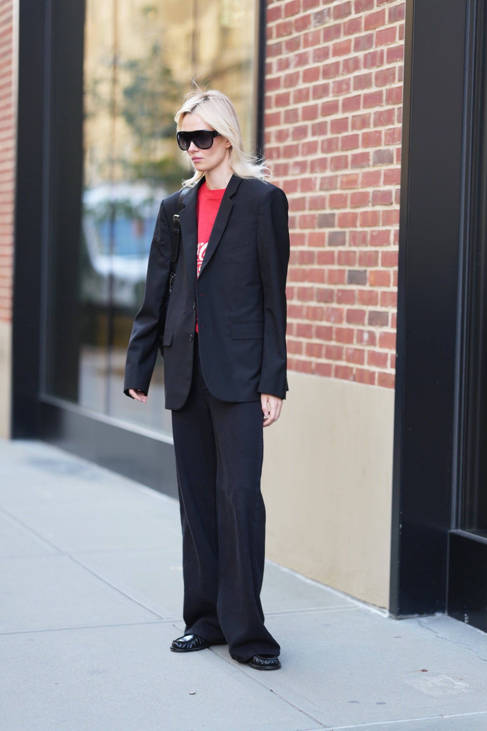 A guest wore trousers with loafers at New York Fashion Week 2026