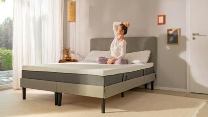A mattress in a box - the emma original mattress on a grey fabric bed
