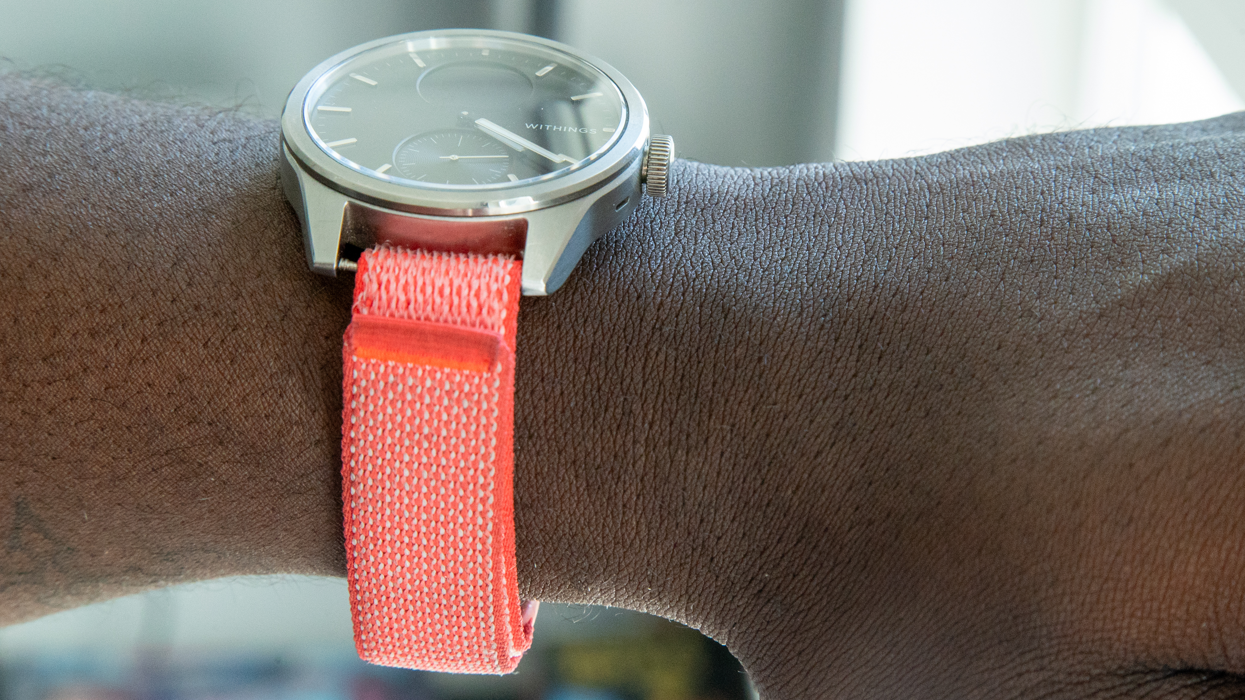 Google Fitbit Air band with an analogue watch