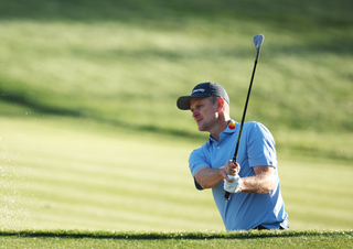 Justin Rose plays a bunker shot