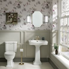 downstairs toilet with white sink and wood panelling