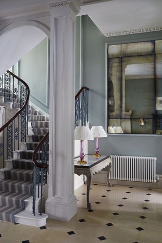 Tile floor, blue walls and stair railings