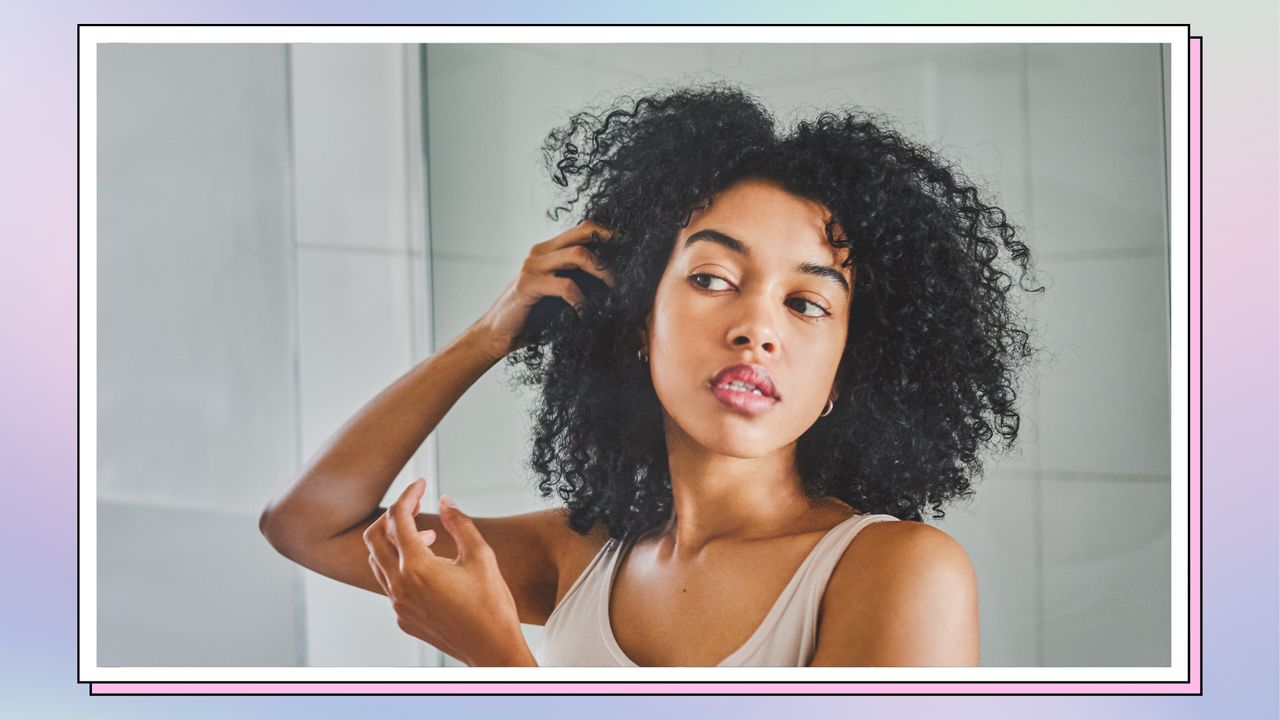 woman checking skin in mirror