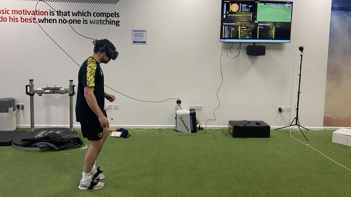 A football player using a VR headset and Rezzil&amp;#039;s training software