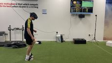 A football player using a VR headset and Rezzil's training software
