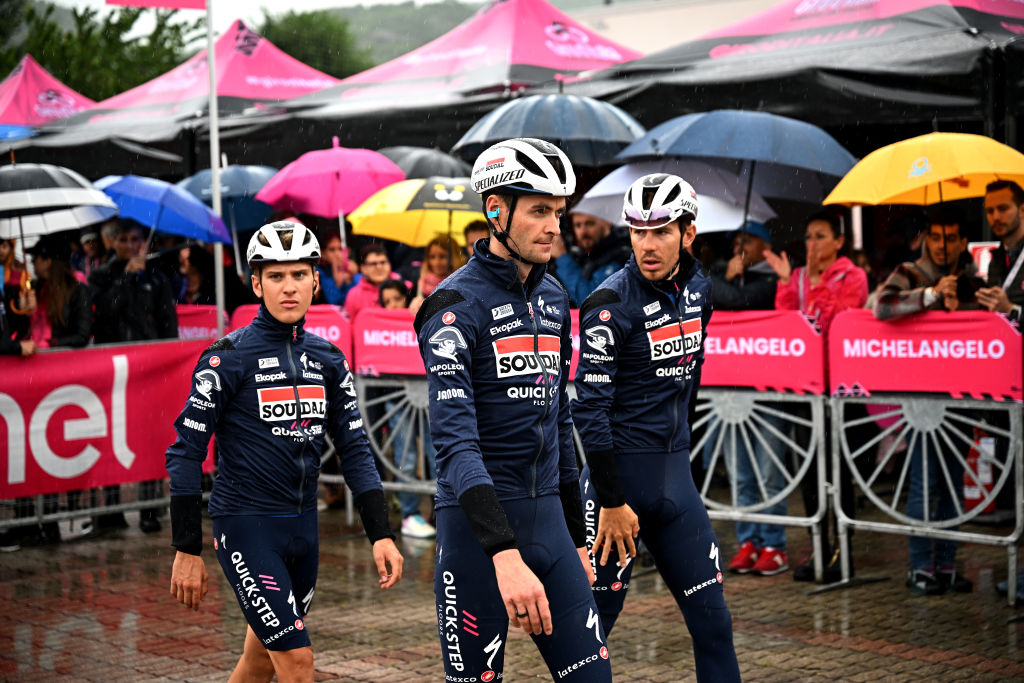 BORGOFRANCO DIVREA ITALY MAY 19 LR Ilan Van Wilder of Belgium Pieter Serry of Belgium and Davide Ballerini of Italy and Team Soudal Quick Step prior to the 106th Giro dItalia 2023 Stage 13 a 199km stage from Borgofranco dIvrea to CransMontana Valais 1456m UCIWT on May 19 2023 in Borgofranco dIvrea Italy Photo by Stuart FranklinGetty Images