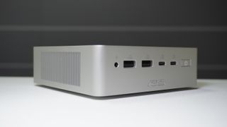 The Asus Ascent QN10 mini PC on a table