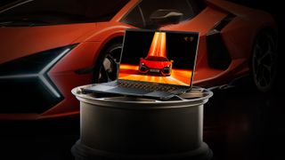 razer laptop in front of designer car