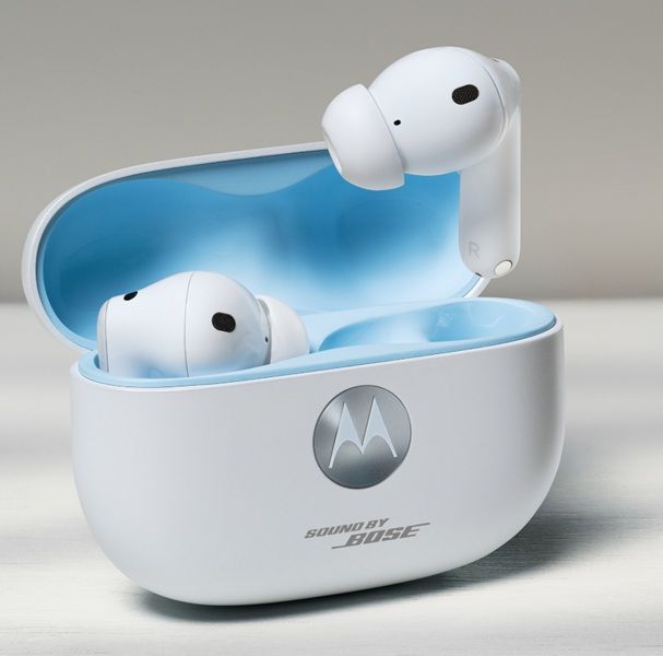 A leaked render of the Moto Buds 2 Plus in white, sitting inside of its charging case with a light blue aesthetic.