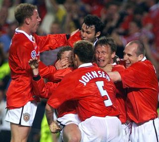 Ole Gunnar Solskjaer is mobbed by teammates after scoring a last seconds winner in the the Champions League final