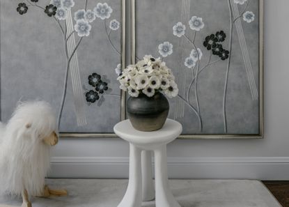 A room with panels decorated with floral wallpaper 