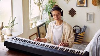 Woman playing Yamaha P-45 piano