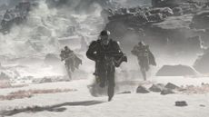 Three Helldivers run towards the camera over a dusty and grey terrain.